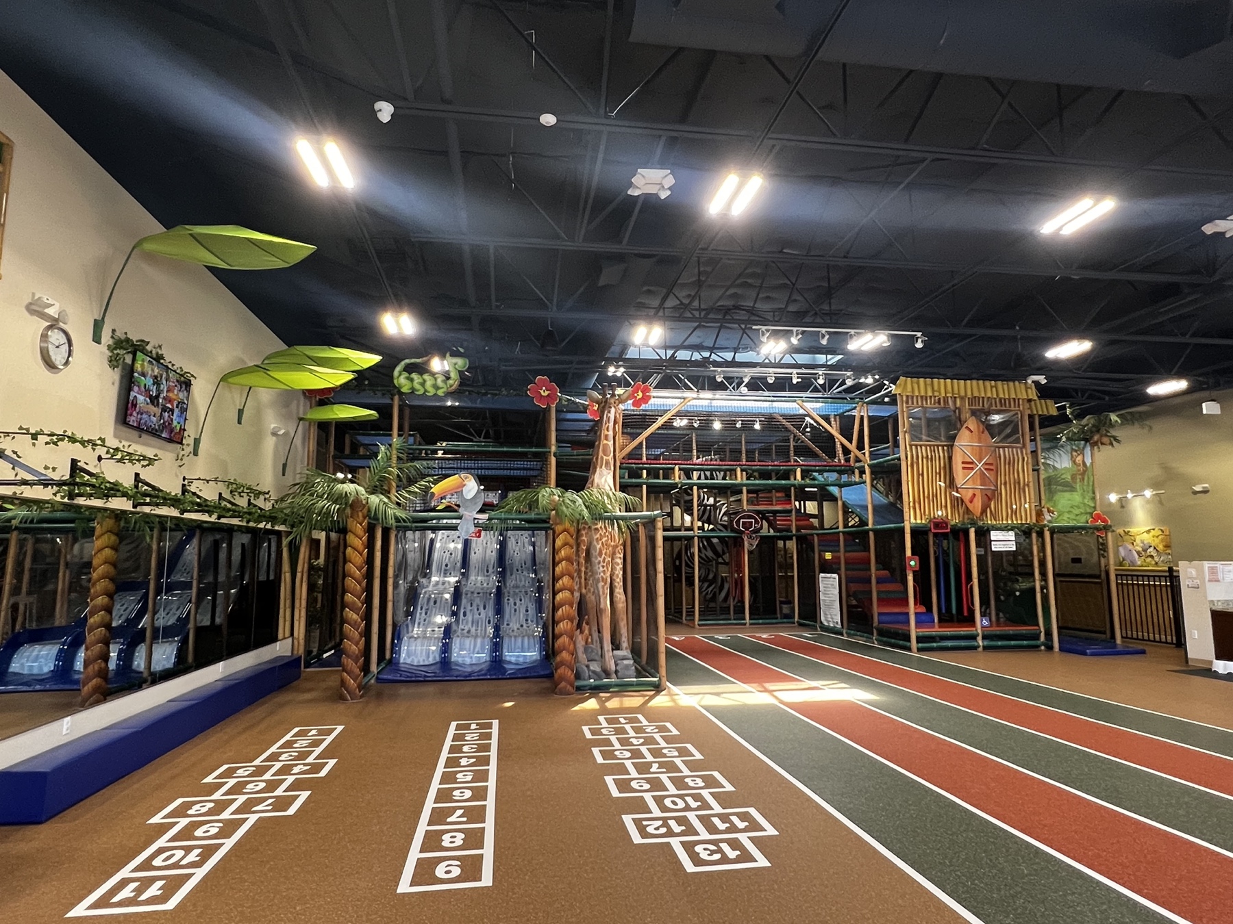 Inside Safari Run Plano - giraffe feature, running track, hopscotch floor