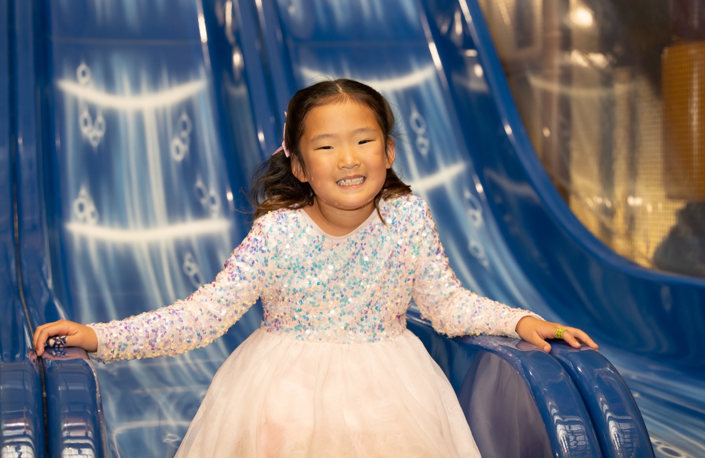 Girl on the blue slide