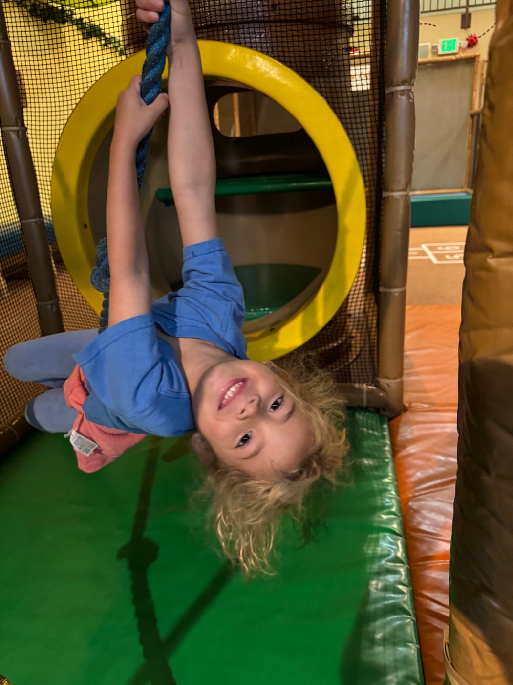 Girl swinging in the structure